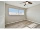 A bedroom featuring light-colored walls, wood-look floors and a window for natural light at 1701 62Nd S Ter, St Petersburg, FL 33712
