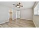 Spacious bedroom with closet and wood-look flooring, offering ample natural light at 1701 62Nd S Ter, St Petersburg, FL 33712