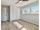 Bedroom with wood-look floors, bi-fold closet and neutral paint at 1701 62Nd S Ter, St Petersburg, FL 33712