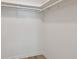 Walk-in closet with white walls, flooring and a shelf and hanging rod at 1701 62Nd S Ter, St Petersburg, FL 33712
