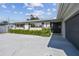 Charming single-story home featuring a manicured lawn and a paved driveway leading to the entrance at 1701 62Nd S Ter, St Petersburg, FL 33712