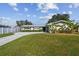 Charming single-story home with a well-maintained lawn, lush greenery, and a long driveway leading to the entrance at 1701 62Nd S Ter, St Petersburg, FL 33712