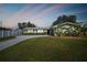 Charming single-story home with a well-maintained lawn, lush greenery, and a long driveway leading to the entrance at 1701 62Nd S Ter, St Petersburg, FL 33712