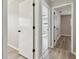 Hallway with doors leading to bedrooms, showcasing modern flooring and neutral paint at 1701 62Nd S Ter, St Petersburg, FL 33712