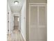 Bright hallway with new light wood flooring and white doors at 1701 62Nd S Ter, St Petersburg, FL 33712