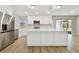 Spacious kitchen features stainless steel appliances, a large island, and white cabinets, perfect for cooking and entertaining at 1701 62Nd S Ter, St Petersburg, FL 33712