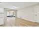 Bright and airy living room with access to a screened patio, complete with new floors at 1701 62Nd S Ter, St Petersburg, FL 33712