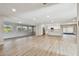 Bright open-plan living room with lots of natural light, featuring new flooring at 1701 62Nd S Ter, St Petersburg, FL 33712