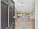 Open view from the front door into a spacious living room with hardwood floors and bright natural light at 1701 62Nd S Ter, St Petersburg, FL 33712