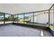 View of a screened-in patio that overlooks the backyard at 1701 62Nd S Ter, St Petersburg, FL 33712