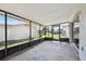 The screened-in patio offers a peaceful outdoor area with concrete flooring, views of the yard, and access to the home at 1701 62Nd S Ter, St Petersburg, FL 33712