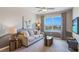 Relaxing living room with a comfortable sofa, modern decor, scenic views, and a unique side table at 1703 Tahitian Sunrise Dr, Plant City, FL 33565