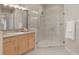 Bathroom with a corner glass shower, vanity with a single sink, and neutral finishes at 18050 Cozumel Isle Dr, Tampa, FL 33647