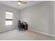 A bright bedroom features carpet floors, a ceiling fan, and plenty of natural light at 18050 Cozumel Isle Dr, Tampa, FL 33647