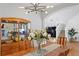 Bright dining room with a modern chandelier, decorative cabinet, hardwood floors, and stairway at 18050 Cozumel Isle Dr, Tampa, FL 33647
