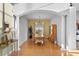 Formal dining room with elegant lighting, hardwood floors, and views of the lush backyard at 18050 Cozumel Isle Dr, Tampa, FL 33647
