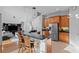 Kitchen with stainless steel appliances, breakfast bar, and view into the living room at 18050 Cozumel Isle Dr, Tampa, FL 33647