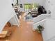 Bright and airy living room with hardwood floors and soaring ceilings and access to the backyard at 18050 Cozumel Isle Dr, Tampa, FL 33647