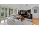 Spacious living room with a view of the backyard and a cozy seating area at 18050 Cozumel Isle Dr, Tampa, FL 33647