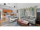 Open floor plan living room with a view of the kitchen and backyard at 18050 Cozumel Isle Dr, Tampa, FL 33647