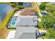 Aerial view of homes nestled on the water, showcasing in-ground pools and great neighbors at 19309 Garden Quilt Cir, Lutz, FL 33558