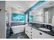 Stunning bathroom featuring a soaking tub, dual sinks, and a separate glass-enclosed shower at 19309 Garden Quilt Cir, Lutz, FL 33558