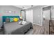 Relaxing bedroom features a cozy bed, natural light, and a closet at 19309 Garden Quilt Cir, Lutz, FL 33558