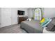 Comfortable bedroom showcasing a window seat, stylish decor, and wood-look floors at 19309 Garden Quilt Cir, Lutz, FL 33558