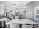 Bright dining area with seating for six offers a seamless transition to the open-concept kitchen and living room at 19309 Garden Quilt Cir, Lutz, FL 33558