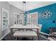 Stylish dining room with marble table, comfortable seating, modern lighting fixture and artistic wall decor at 19309 Garden Quilt Cir, Lutz, FL 33558