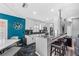 Beautiful kitchen featuring white cabinets, black countertops, stainless steel appliances, and a breakfast bar at 19309 Garden Quilt Cir, Lutz, FL 33558