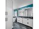 The main bathroom includes a double sink vanity, standalone tub, and modern fixtures at 19309 Garden Quilt Cir, Lutz, FL 33558