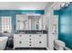 The main bathroom features a double sink vanity with black counters and stylish decor at 19309 Garden Quilt Cir, Lutz, FL 33558