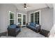 Cozy outdoor seating area with a ceiling fan, perfect for relaxing or entertaining at 19309 Garden Quilt Cir, Lutz, FL 33558