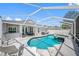 A luxurious pool with a spa and screened-in patio, ideal for outdoor enjoyment and relaxation at 19309 Garden Quilt Cir, Lutz, FL 33558