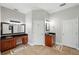 Spacious bathroom with dual sinks, dark granite countertops, and separate walk-in closet at 2011 Water Wheel Ct, Dunedin, FL 34698