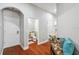 Hallway view of half bathroom with pedestal sink at 2011 Water Wheel Ct, Dunedin, FL 34698