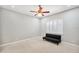 This bedroom features neutral walls, a fan, window shutters and plenty of space for a bed at 2011 Water Wheel Ct, Dunedin, FL 34698