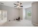 Minimalist bedroom with fitness equipment and neutral walls, creating a versatile and serene living space at 2011 Water Wheel Ct, Dunedin, FL 34698