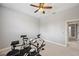 Carpeted bedroom features a ceiling fan, recessed lighting and an adjacent room at 2011 Water Wheel Ct, Dunedin, FL 34698