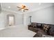 Bonus room featuring recessed lights, crown molding, and a leather sectional sofa at 2011 Water Wheel Ct, Dunedin, FL 34698