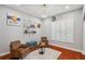 Inviting sitting area featuring hardwood floors, modern decor, and a large window at 2011 Water Wheel Ct, Dunedin, FL 34698