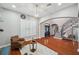 Inviting living room featuring hardwood floors, plantation shutters, and an open floor plan at 2011 Water Wheel Ct, Dunedin, FL 34698