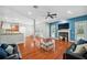 Bright living room with hardwood floors, fireplace, and access to the pool at 2011 Water Wheel Ct, Dunedin, FL 34698