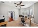 Well lit home office with large windows, modern fixtures, and a ceiling fan at 2011 Water Wheel Ct, Dunedin, FL 34698
