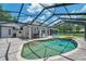 Gorgeous screened-in pool with attached spa and comfortable outdoor seating on the brick-paved patio at 2011 Water Wheel Ct, Dunedin, FL 34698