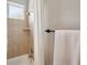 Shower featuring beige tile, a rainfall showerhead, and white accents, creating a relaxing spa-like experience at 2011 Water Wheel Ct, Dunedin, FL 34698
