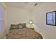 Well-lit bedroom with a decorative table and accent pillows at 2128 Worthington Greens Dr, Sun City Center, FL 33573