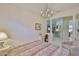 Bright bedroom featuring tile flooring, ample natural light and decorative pillars at 2128 Worthington Greens Dr, Sun City Center, FL 33573
