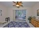 Versatile bonus room with sliding glass doors, patterned rug, and wood furnishings at 2128 Worthington Greens Dr, Sun City Center, FL 33573